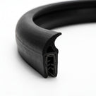 Self grip top seal bent into a full loop, showing a wave-shaped sponge tail and toothed grip