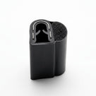 Short upright block of self grip side seal showing a D-shaped sponge bulb and smooth metal-lined grip