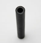 Short black rubber carb breather hose viewed end-on against white background