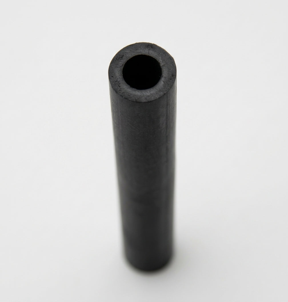 Short black rubber carb breather hose viewed end-on against white background