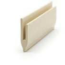 Cream PVC roof trim standing upright, slotted channel profile viewed at an angle