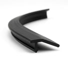 Black PVC edge trim curved into a loop, showing angled flag and base leg
