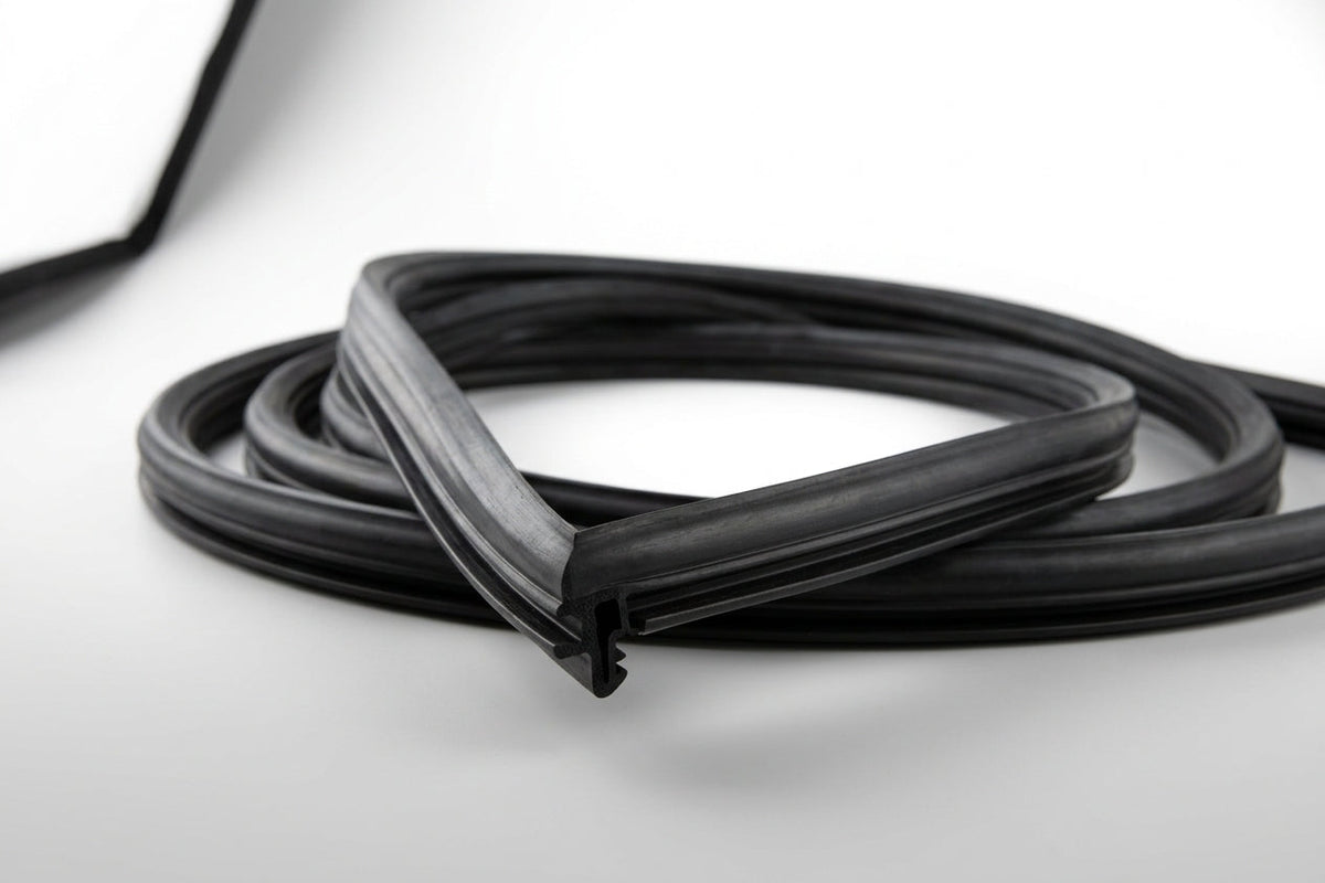 Black windscreen surround coiled into a loose loop, white background