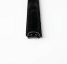 End-on view of black carpet-covered trim showing its H-shaped channel core