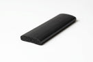Flat black sponge strip with domed top, angled studio shot