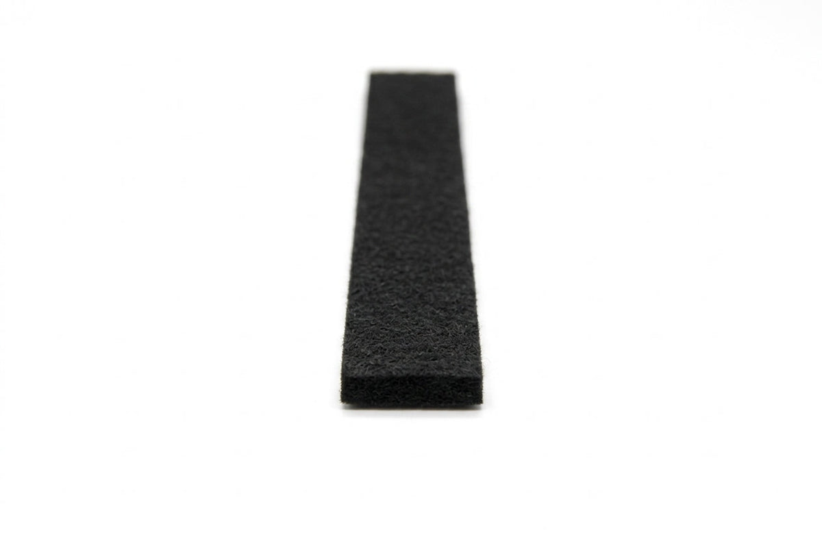 Felt strip end-on, showing the dense black fibrous felt texture and flat profile