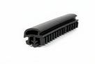 Black quarterlight seal with a fine serrated edge, photographed at an angle