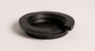 Black rubber fuel filler cap with ridged sealing ring, studio shot