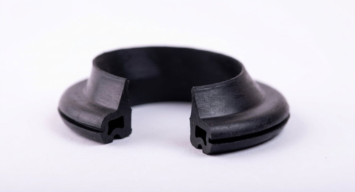 Black rubber fuel filler neck seal ring, studio white background