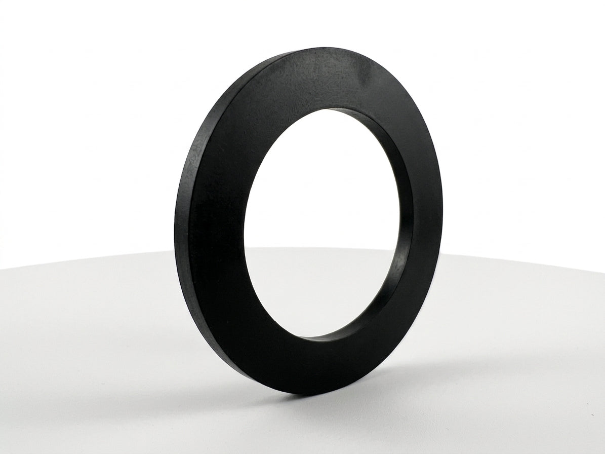 Black rubber ring-shaped fuel cap seal standing upright, white background