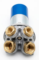 Close-up front view of the fuel pump's brass fittings and blue housing