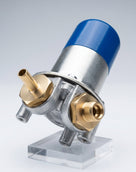 Fuel pump with blue cap and brass threaded ports, studio shot on a clear acrylic stand