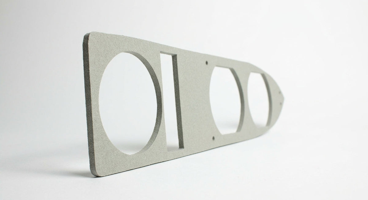 Grey sponge rubber rear lamp gasket with cut-outs for lamp fittings, studio shot