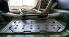 Seat diaphragm fitted into the seat frame of a green Triumph
