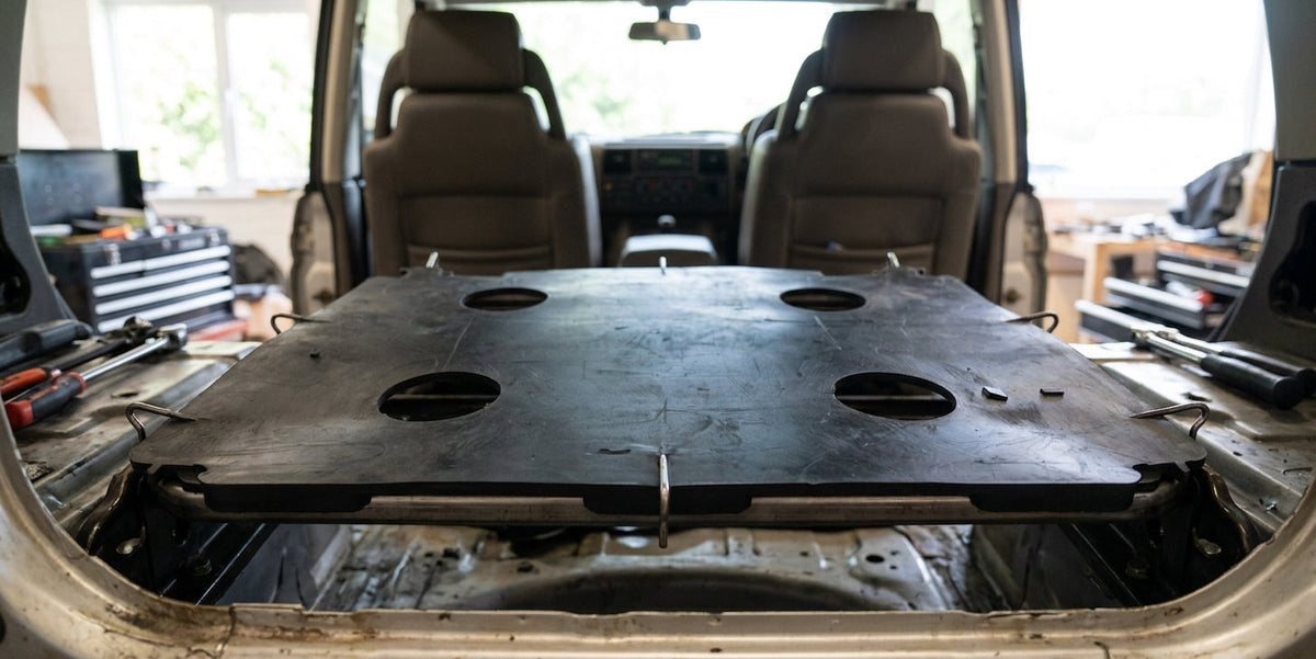 Diaphragm resting on a seat base inside a Land Rover Discovery's rear cabin
