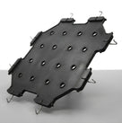 Angled shot of black perforated seat diaphragm with wire fitting hooks