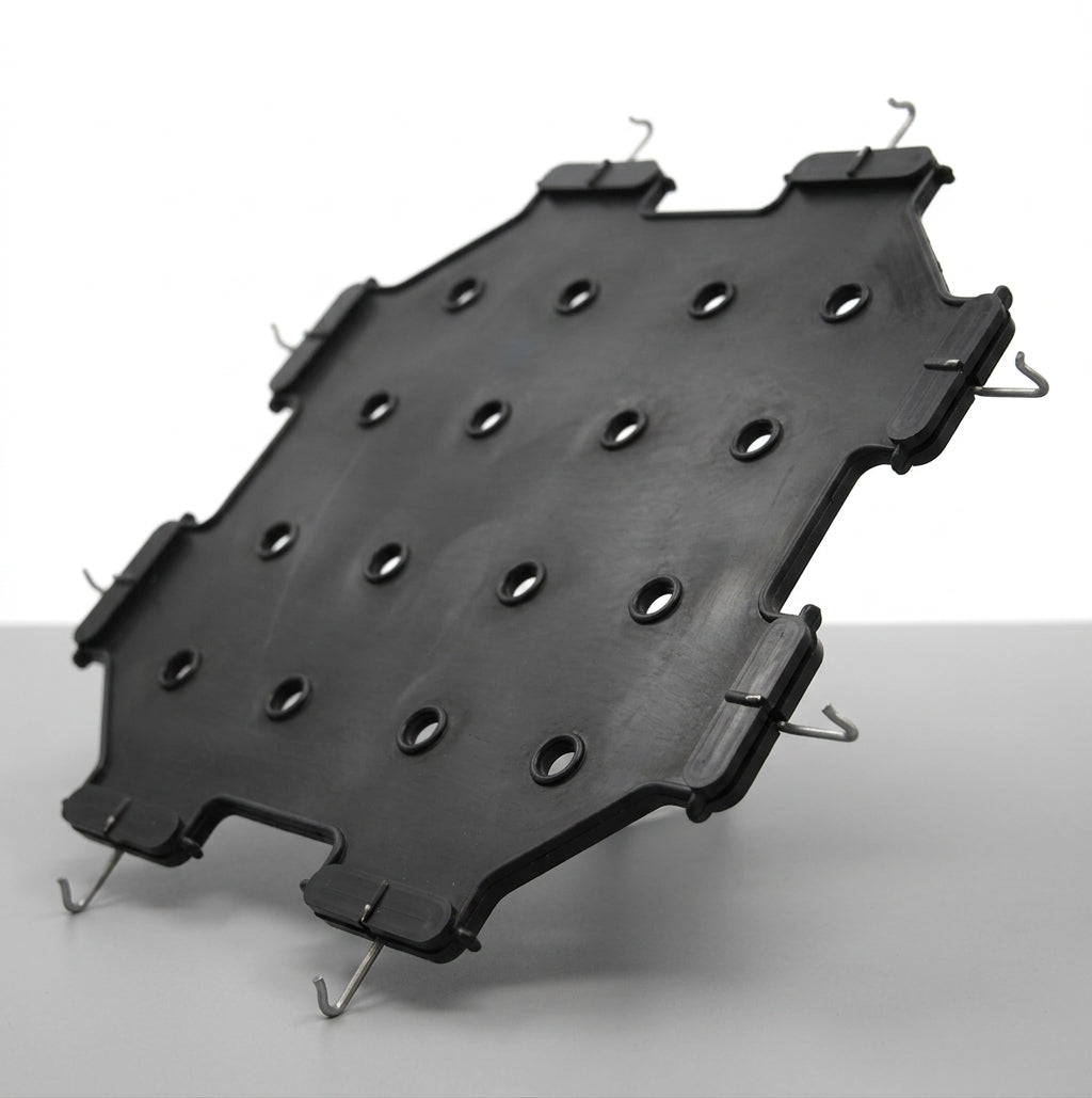 Angled shot of black perforated seat diaphragm with wire fitting hooks