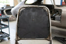Front seat diaphragm fitted into a seat frame during a Jaguar E-Type restoration