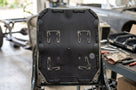 Seat diaphragm panel fitted into a car seat frame with metal hooks visible
