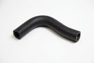 Curved black ribbed heater hose on a plain white background, studio shot