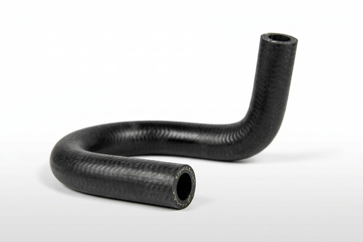 S-shaped black ribbed water hose on white background, studio shot