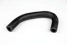 U-shaped black ribbed breather hose on white background, studio shot