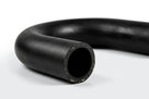 Curved black textured radiator hose with cut end facing camera, studio shot