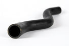 Black radiator top hose with S-shaped bend, studio shot on white