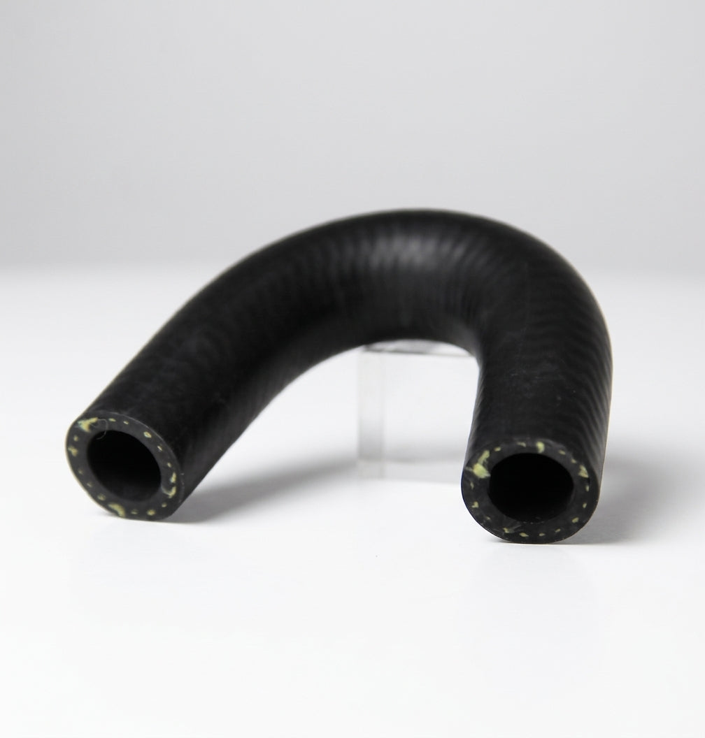 Black U-shaped water pump hose propped on a clear stand, Kevlar threads at ends