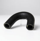Black U-shaped water pump hose propped on a clear stand, Kevlar threads at ends