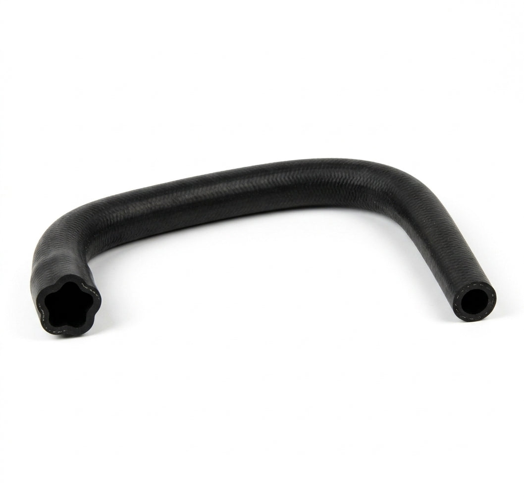 Black rubber drainage hose bent into a U-shape, studio shot on white