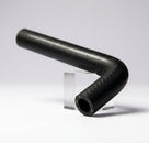 Black heater hose bent at a right angle, studio shot on stand