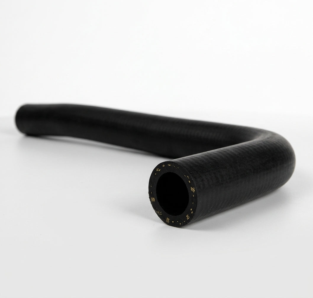 Black heater hose with S-shaped curve, studio shot showing cut end detail
