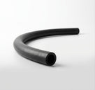 Curved black rubber hose on white background, studio shot