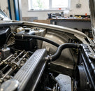 Expansion tank hose fitted in situ between header tank and engine