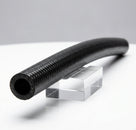 Black textured heater feed hose with gentle curve, studio shot on stand
