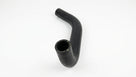 Textured black rubber hose coiled with cut end downward on white studio background
