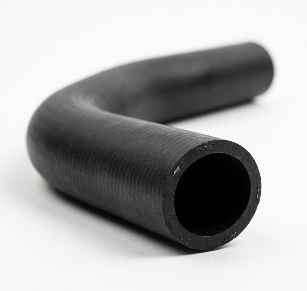 L-shaped black rubber radiator hose on white background, studio shot