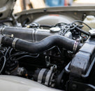 Top radiator hose fitted between engine and radiator on a Triumph TR5 or TR6