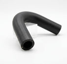 Black ribbed rubber bleed hose bent into shape, studio shot on a stand
