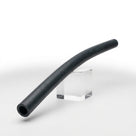Curved black rubber hose resting on a clear stand, studio shot