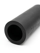 Close-up end view of a black rubber hose connector showing its bore, studio shot