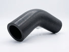 Textured black rubber hose with a curved bend, studio shot on white