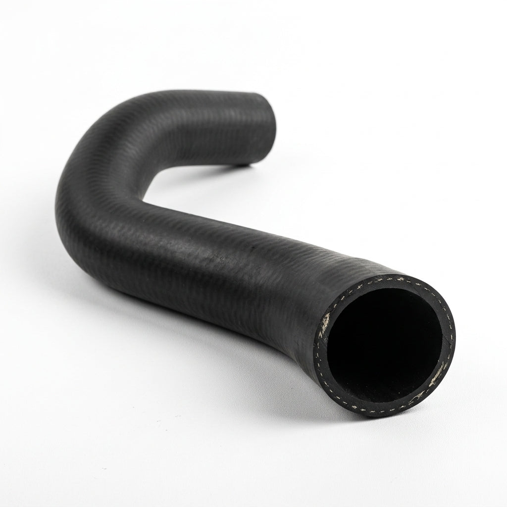 J-shaped black rubber radiator hose on white background, studio shot