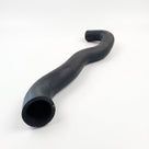 Black radiator hose curving into an S-shape, angled studio shot