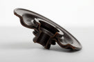 Brown Viton diaphragm seal with scalloped edge, side-on studio shot