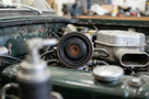 Fuel metering unit diaphragm seal fitted in a green Triumph's engine bay