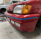 Blue trim strip fitted along a red Fiesta XR2i's front bumper edge