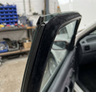 Flocked black inner waist strip fitted along a car's window frame edge