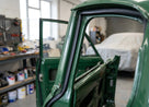 Door seal fitted along the frame of a green classic Jaguar saloon